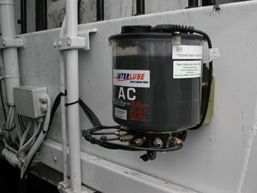 Interlube Multiple Outlet Grease Pump installed in a lorry